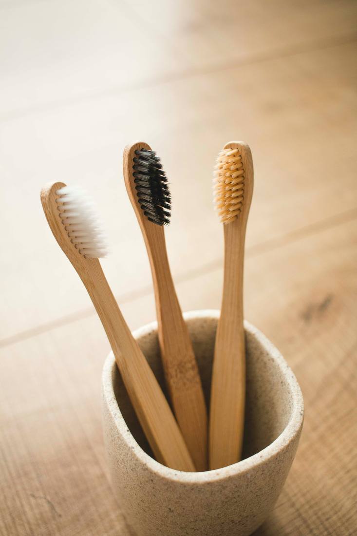 Swapping a replaceable brush head onto a bamboo toothbrush handle